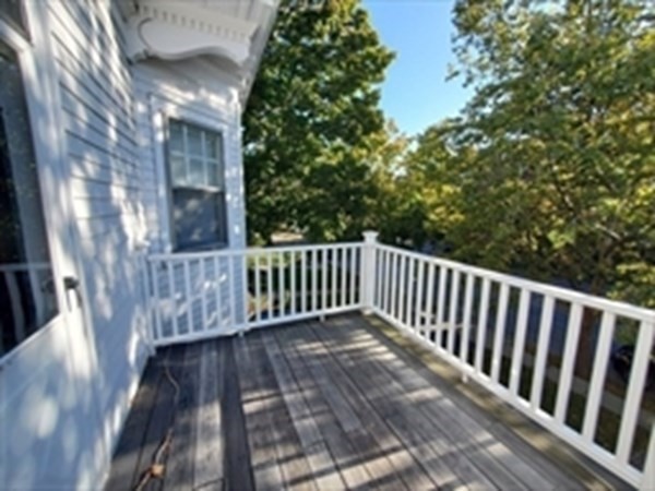29 Bartlett Crescent Brookline, MA 02446 - Photo 5 of 27 a view of deck with wooden floor and fence