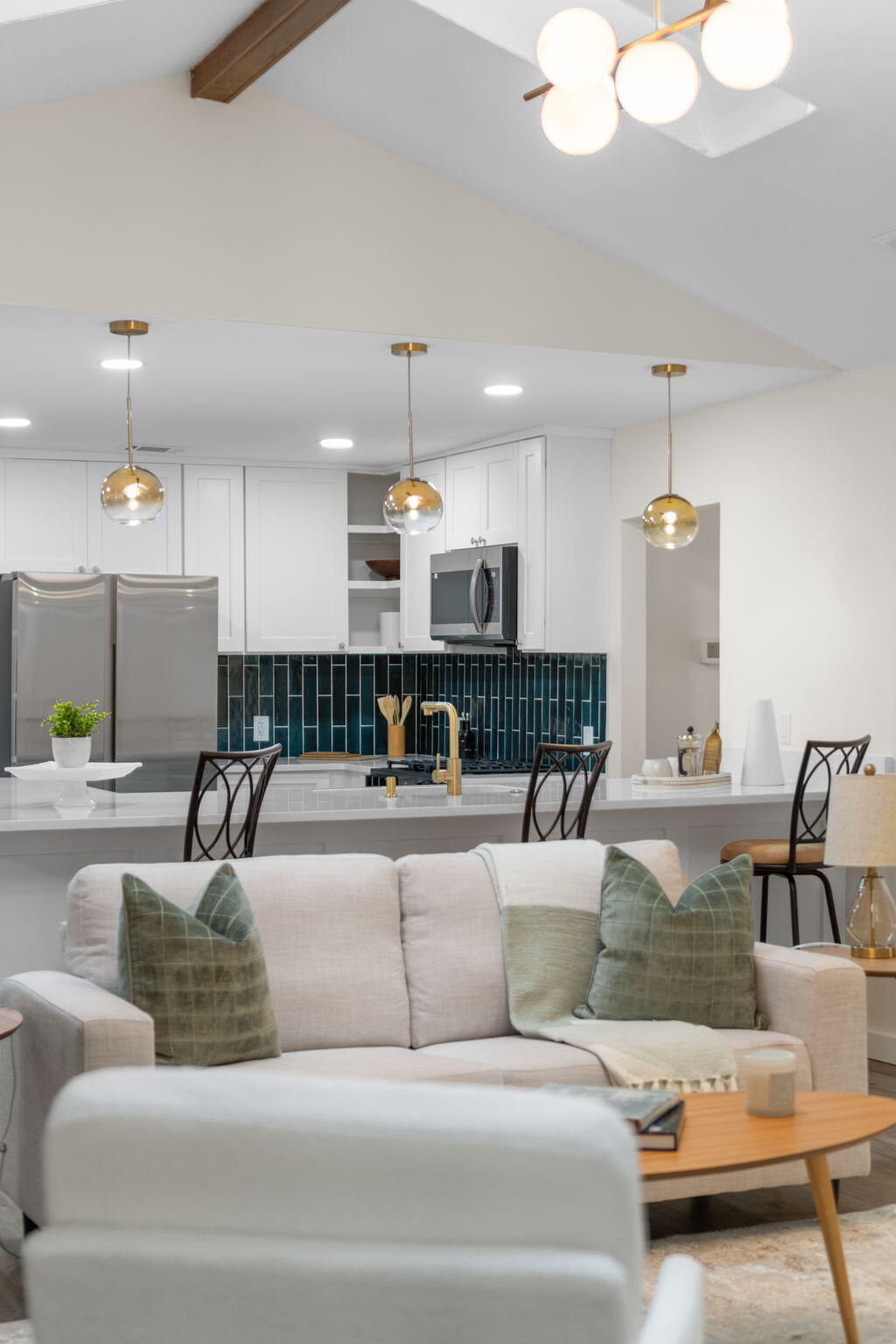 2313 Canal Drive Niceville, FL 32578 - Photo 14 of 52 a living room with furniture kitchen view and a chandelier