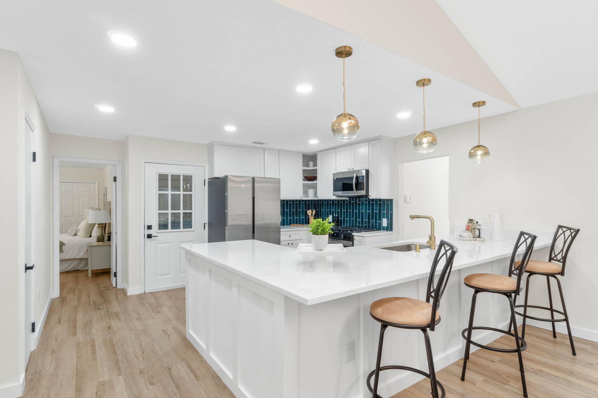 2313 Canal Drive Niceville, FL 32578 - Photo 17 of 52 a kitchen with stainless steel appliances kitchen island granite countertop a refrigerator and a stove top oven
