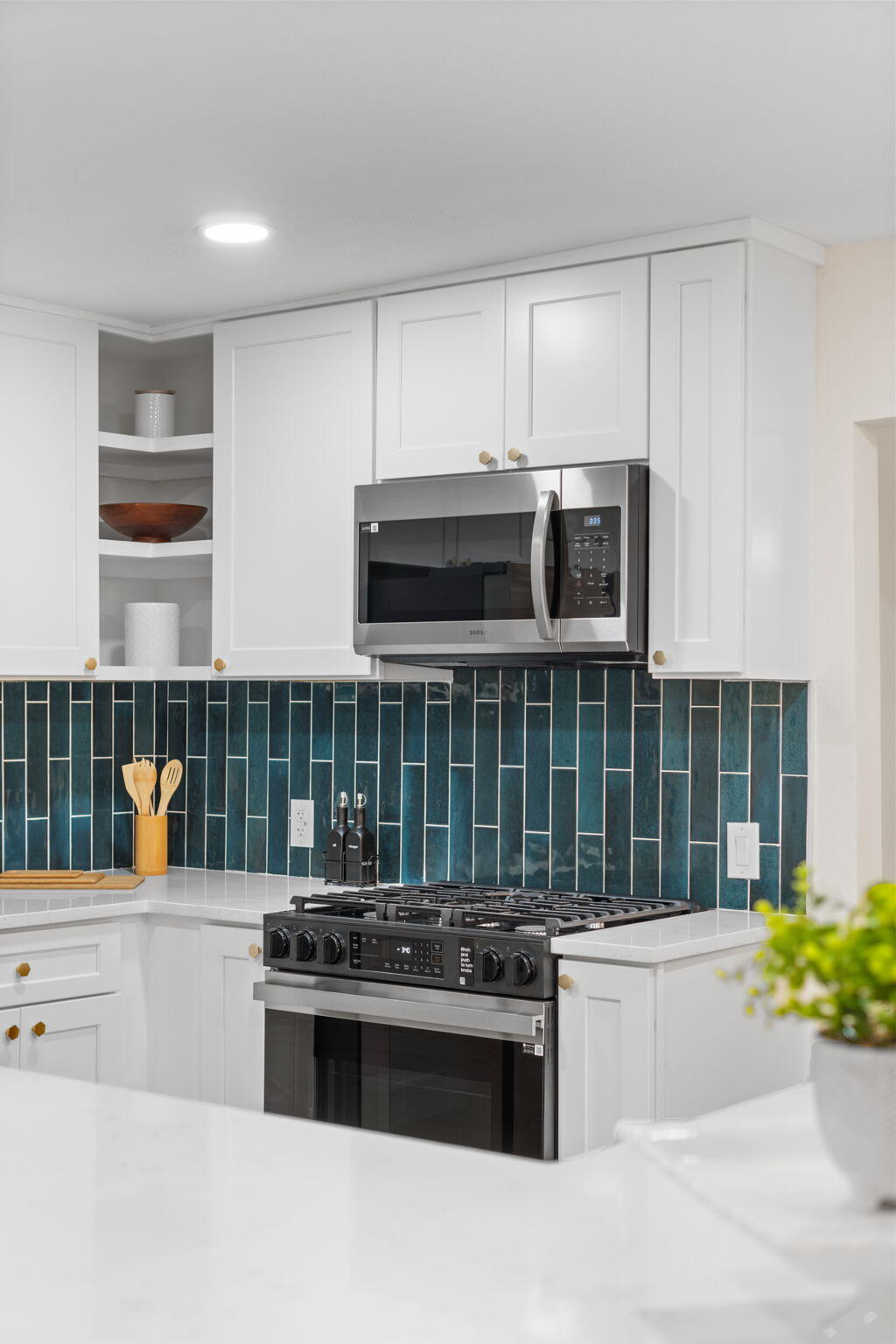 2313 Canal Drive Niceville, FL 32578 - Photo 19 of 52 a kitchen with stainless steel appliances kitchen island granite countertop a stove and a sink