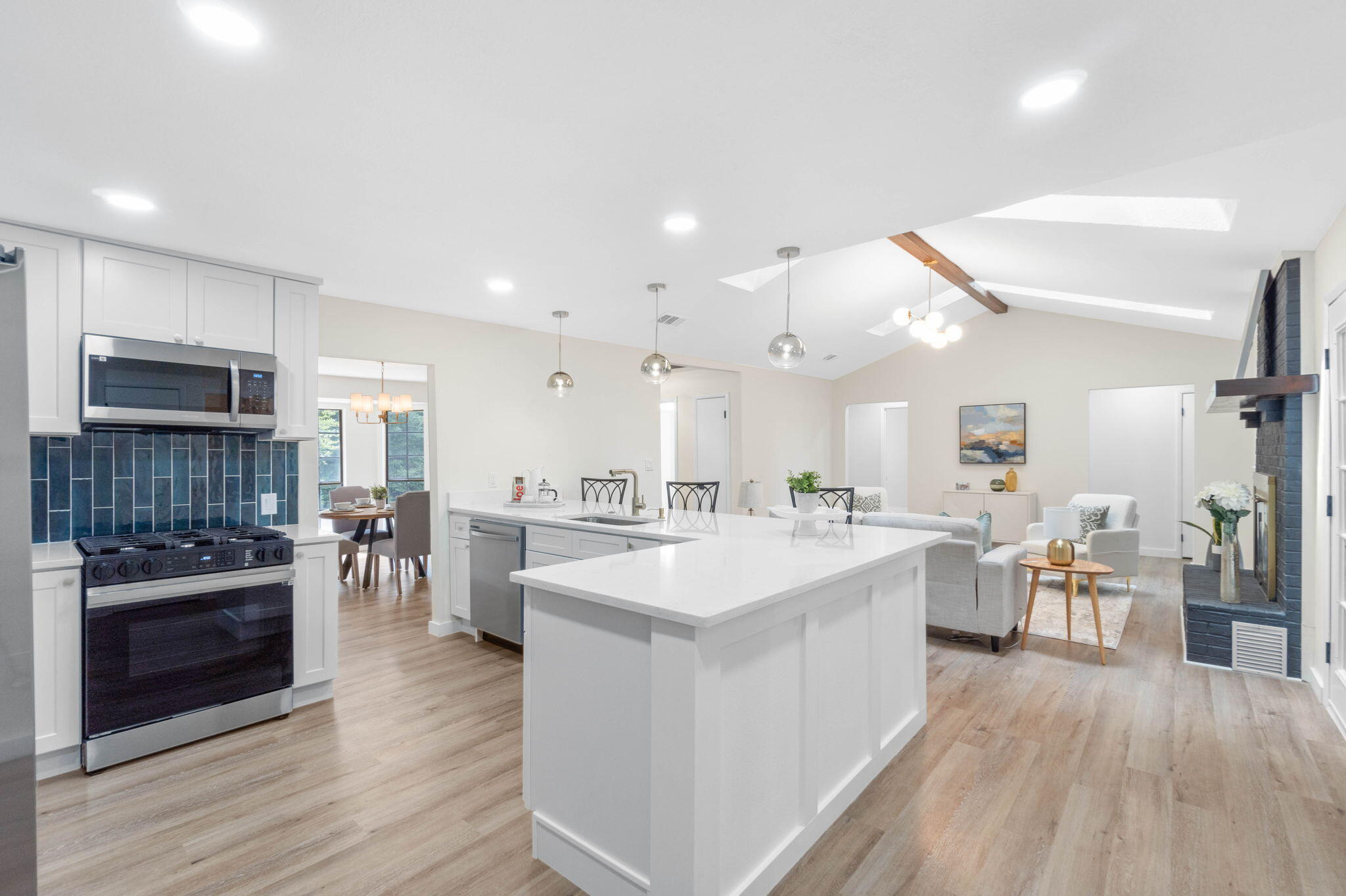 2313 Canal Drive Niceville, FL 32578 - Photo 21 of 52 a large kitchen with kitchen island a sink table and chairs