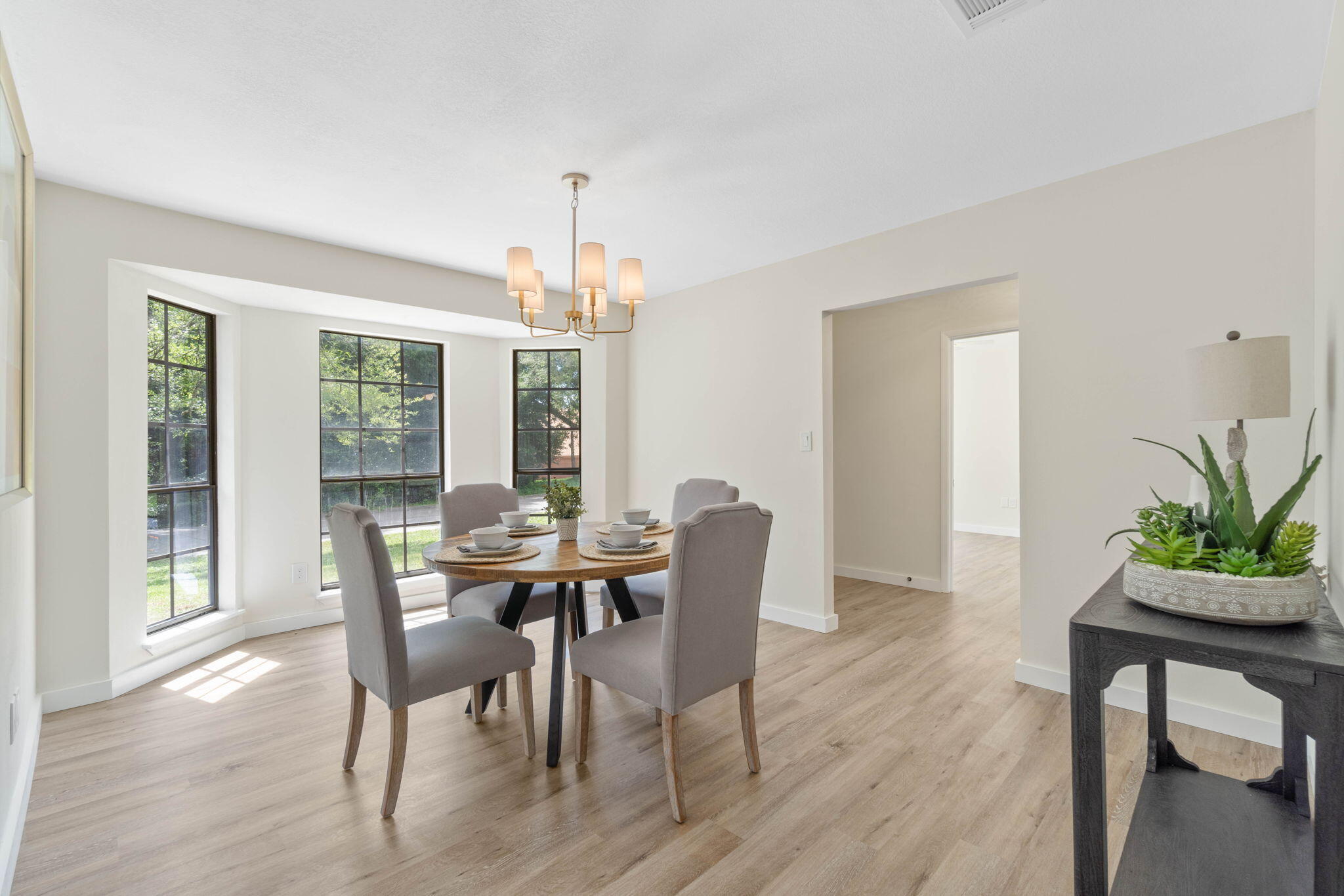 2313 Canal Drive Niceville, FL 32578 - Photo 23 of 52 a view of a dining room with furniture window and wooden floor