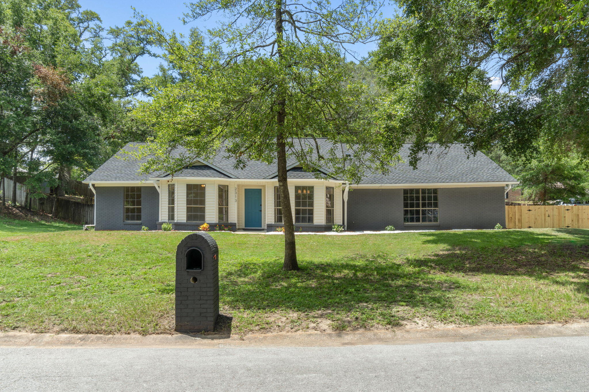 2313 Canal Drive Niceville, FL 32578 - Photo 3 of 52 a front view of house with yard and green space