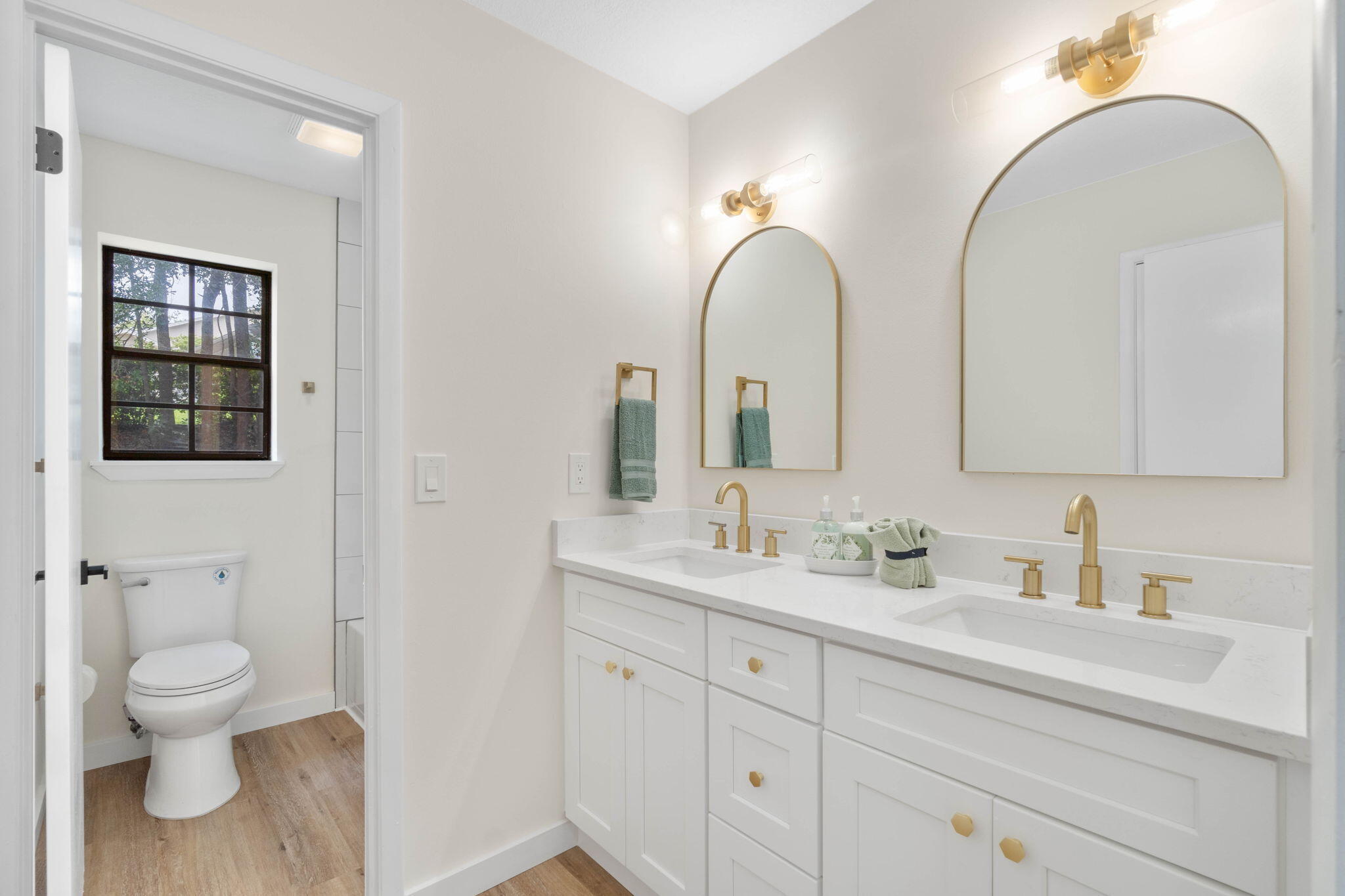 2313 Canal Drive Niceville, FL 32578 - Photo 34 of 52 a bathroom with a double vanity sink toilet and shower