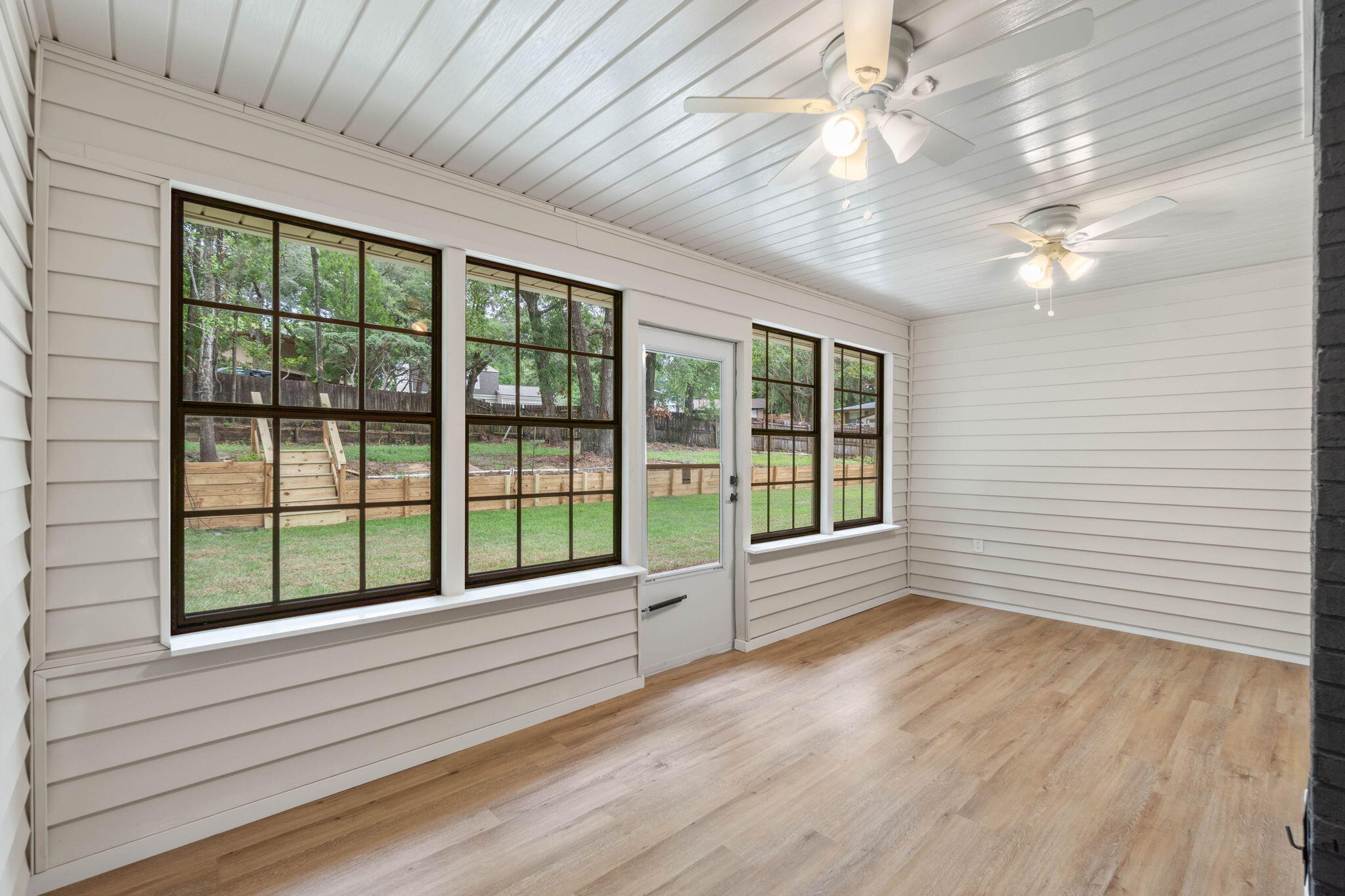 2313 Canal Drive Niceville, FL 32578 - Photo 38 of 52 a view of empty room with wooden floor and fan