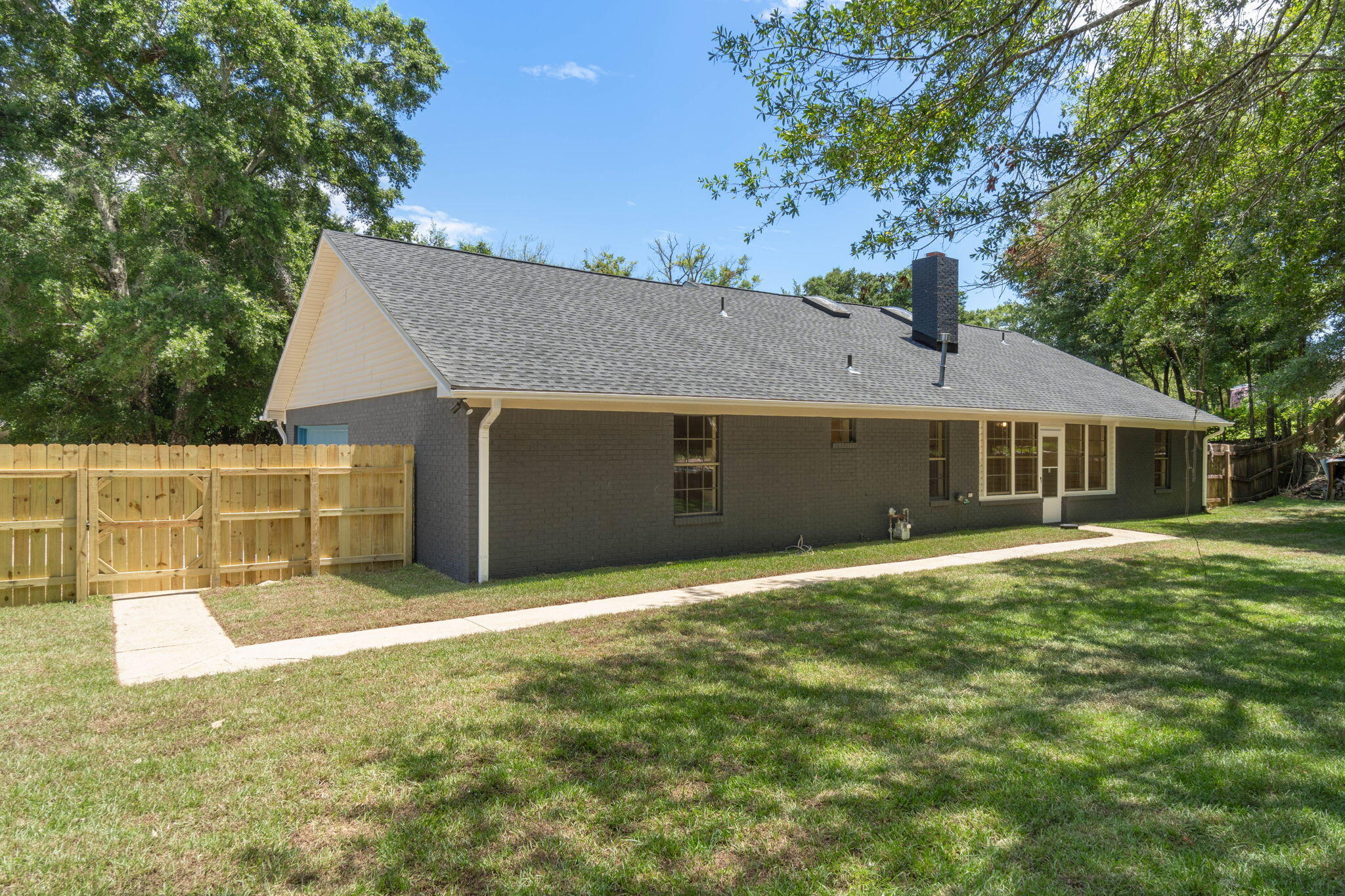 2313 Canal Drive Niceville, FL 32578 - Photo 39 of 52 a front view of a house with a garden