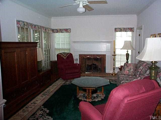 824 Reading Circle Raleigh, NC 27615 - Photo 4 of 12 LARGE FAMILY ROOM ADJACENT TO LIVING ROOM AND EXIT TO SCREEN PORCH