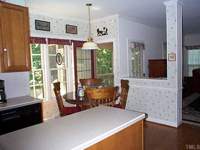 824 Reading Circle Raleigh, NC 27615 - Photo 6 of 12 EAT-IN KITCHEN WITH EXIT TO SCREEN PORCH AND LOWER DECK