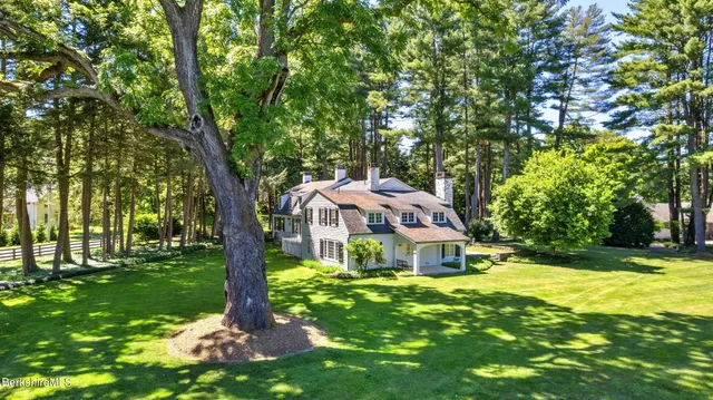 a view of empty room with window and fireplace