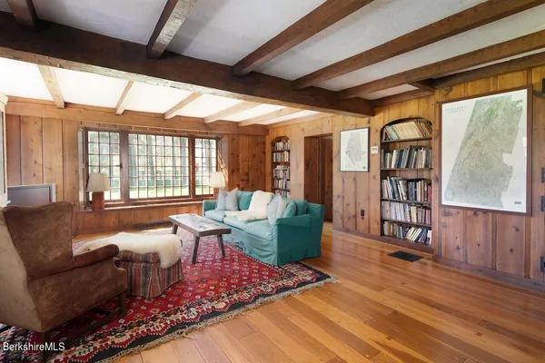 a living room with furniture a fireplace and a table