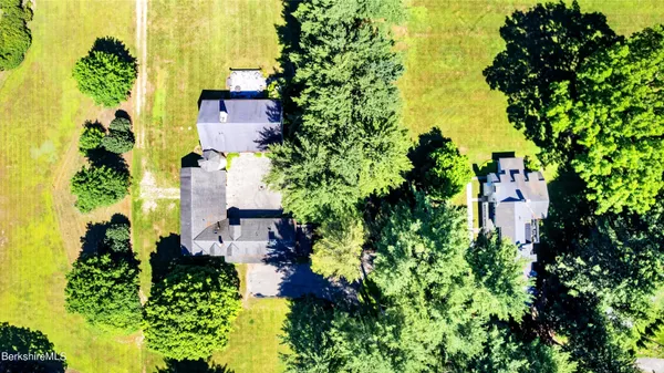 a view of a house with swimming pool and sitting area