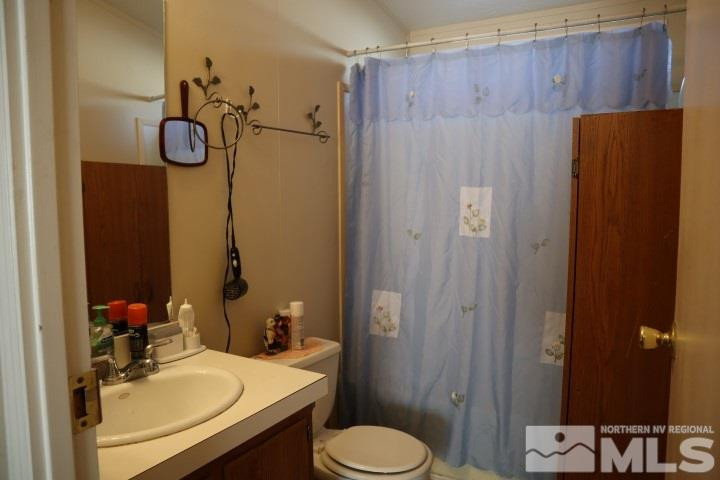 2183 Barberry Way Reno, NV 89512 - Photo 12 of 17 a bathroom with a sink toilet and shower
