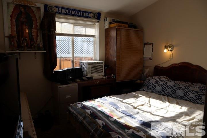 2183 Barberry Way Reno, NV 89512 - Photo 13 of 17 a bedroom with a bed window and dresser