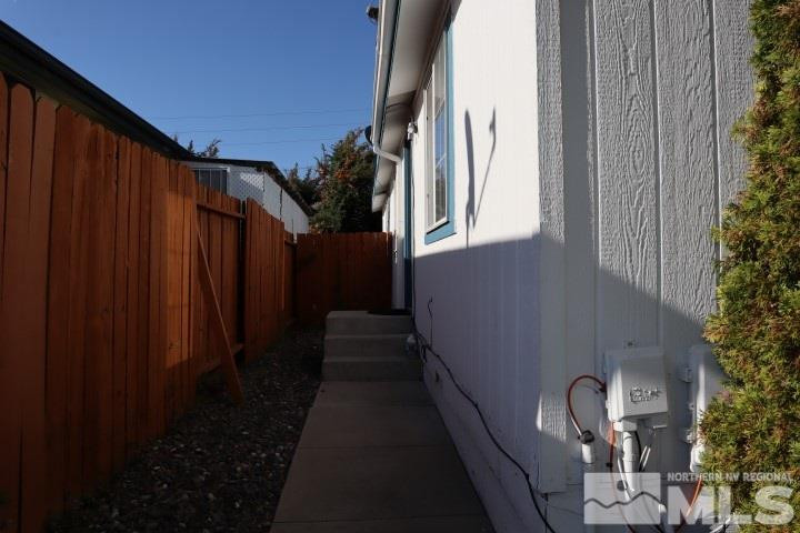 2183 Barberry Way Reno, NV 89512 - Photo 3 of 17 a view of a house with backyard and garden