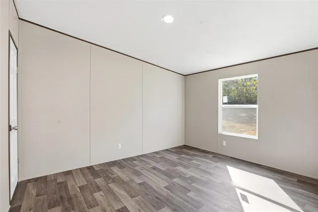 a view of hallway with wooden floor