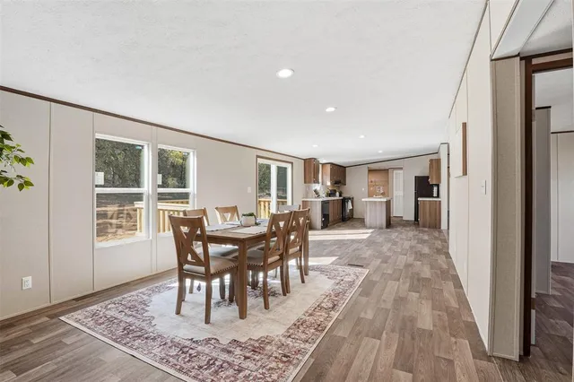 a kitchen with a stove a sink and a refrigerator