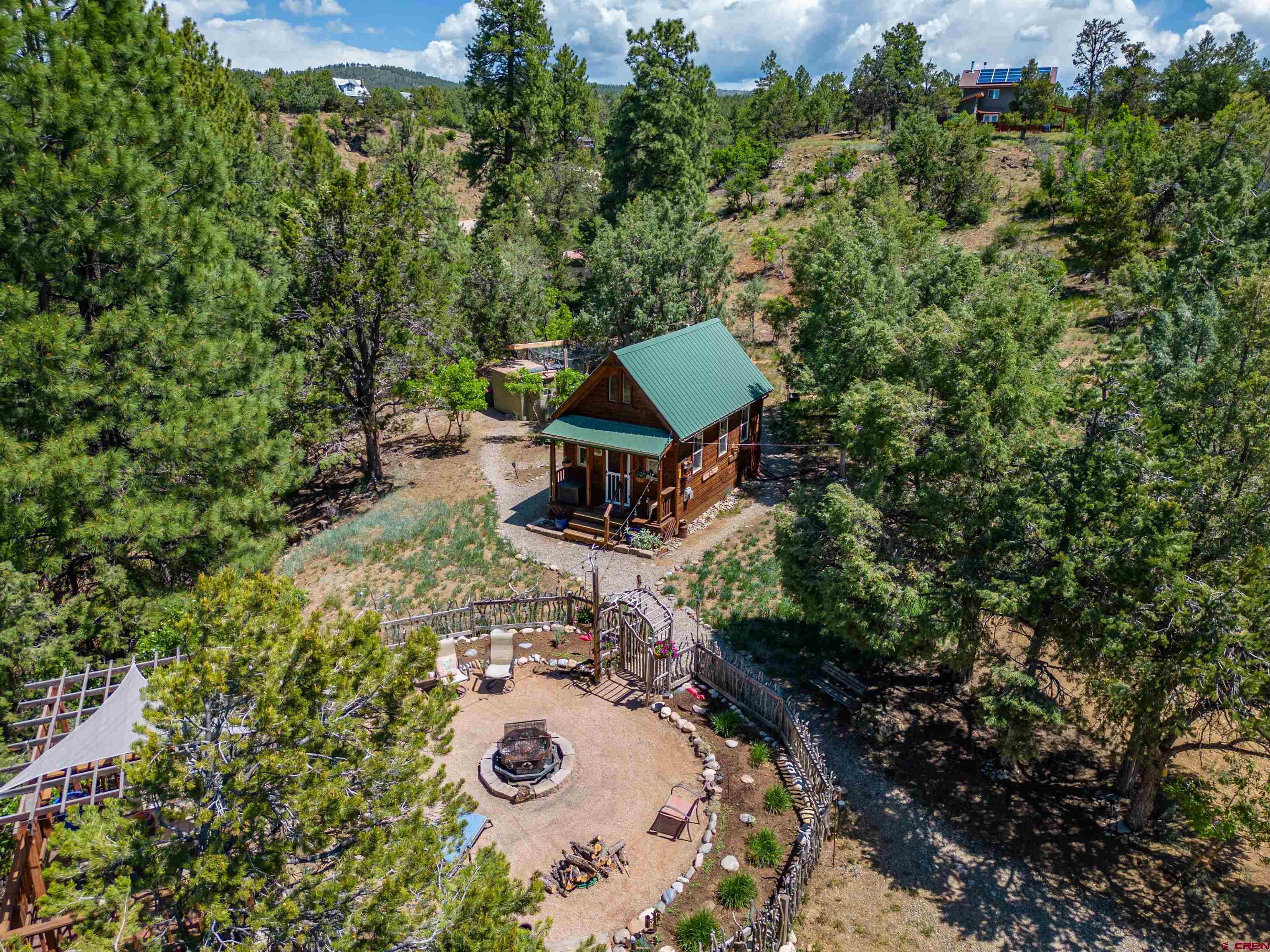 an aerial view of a house with a yard