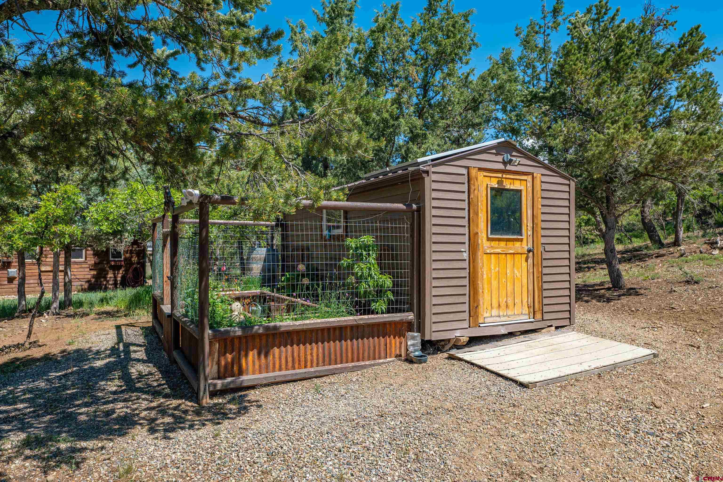 10 Alpine Drive Durango, CO 81301 - Photo 14 of 24 a front view of a house with a yard