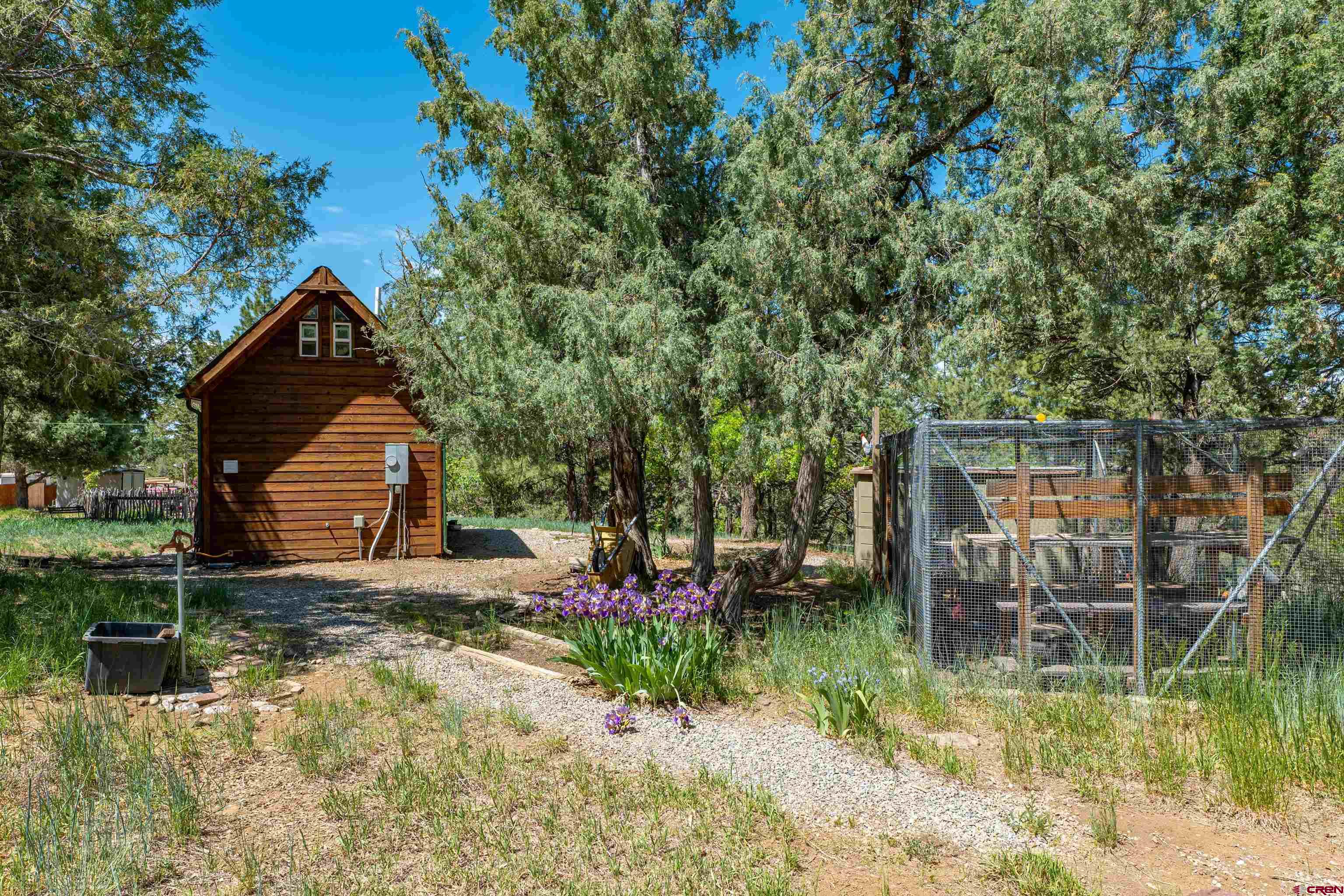 10 Alpine Drive Durango, CO 81301 - Photo 16 of 24 a backyard of a house with yard and outdoor seating