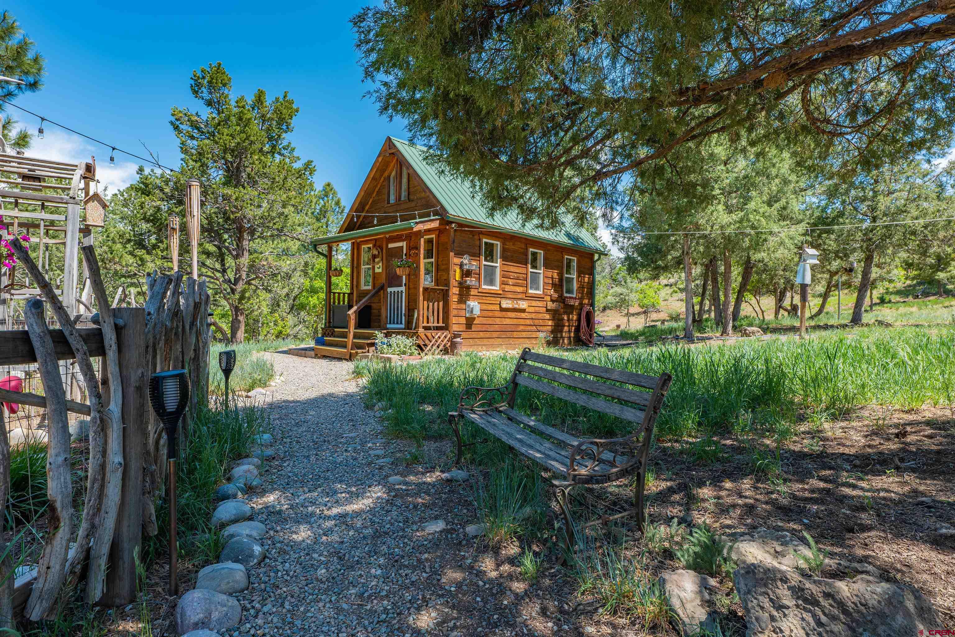 10 Alpine Drive Durango, CO 81301 - Photo 17 of 24 a front view of a house with garden