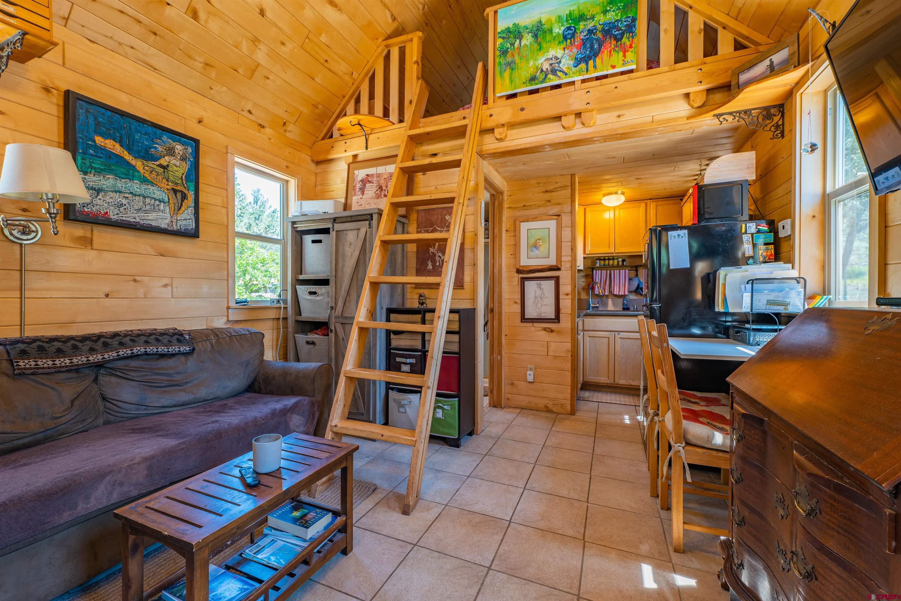 10 Alpine Drive Durango, CO 81301 - Photo 3 of 24 a backyard of a house with barbeque oven table and chairs