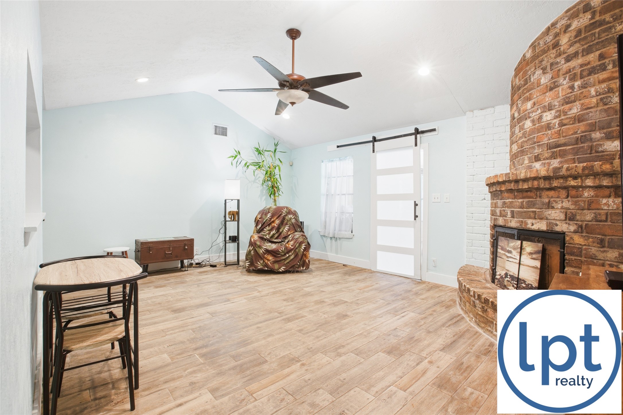 29011 Binefield Street Spring, TX 77386 - Photo 16 of 40 a bedroom with a bed and a chandelier