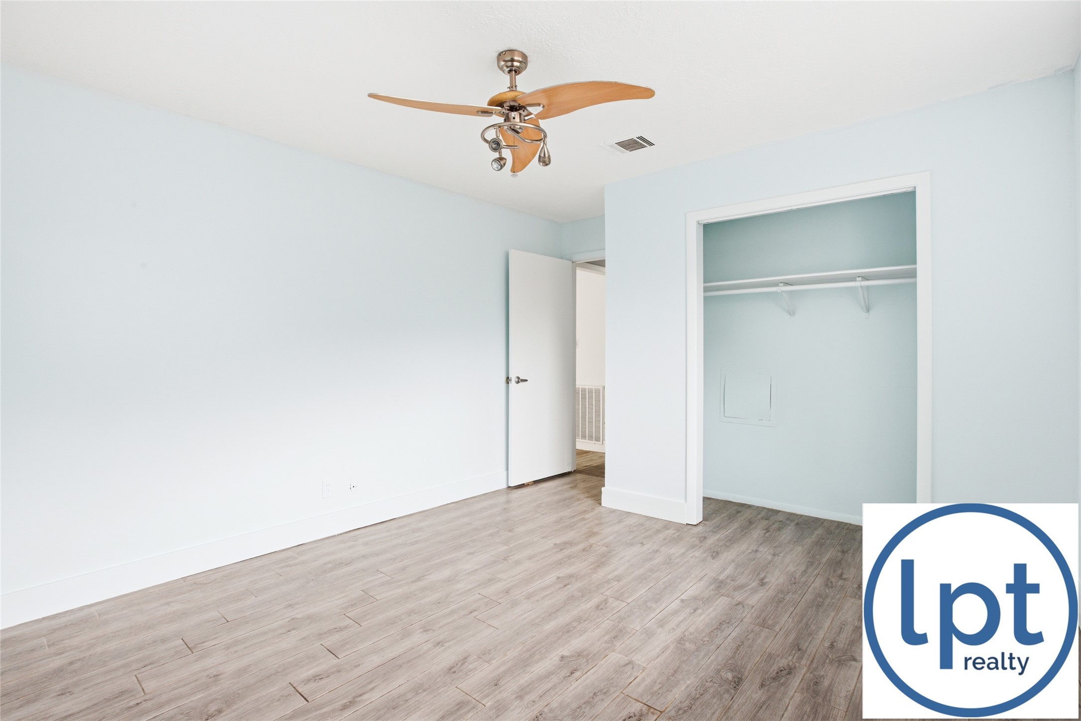 29011 Binefield Street Spring, TX 77386 - Photo 25 of 40 an empty room with wooden floor fan and window