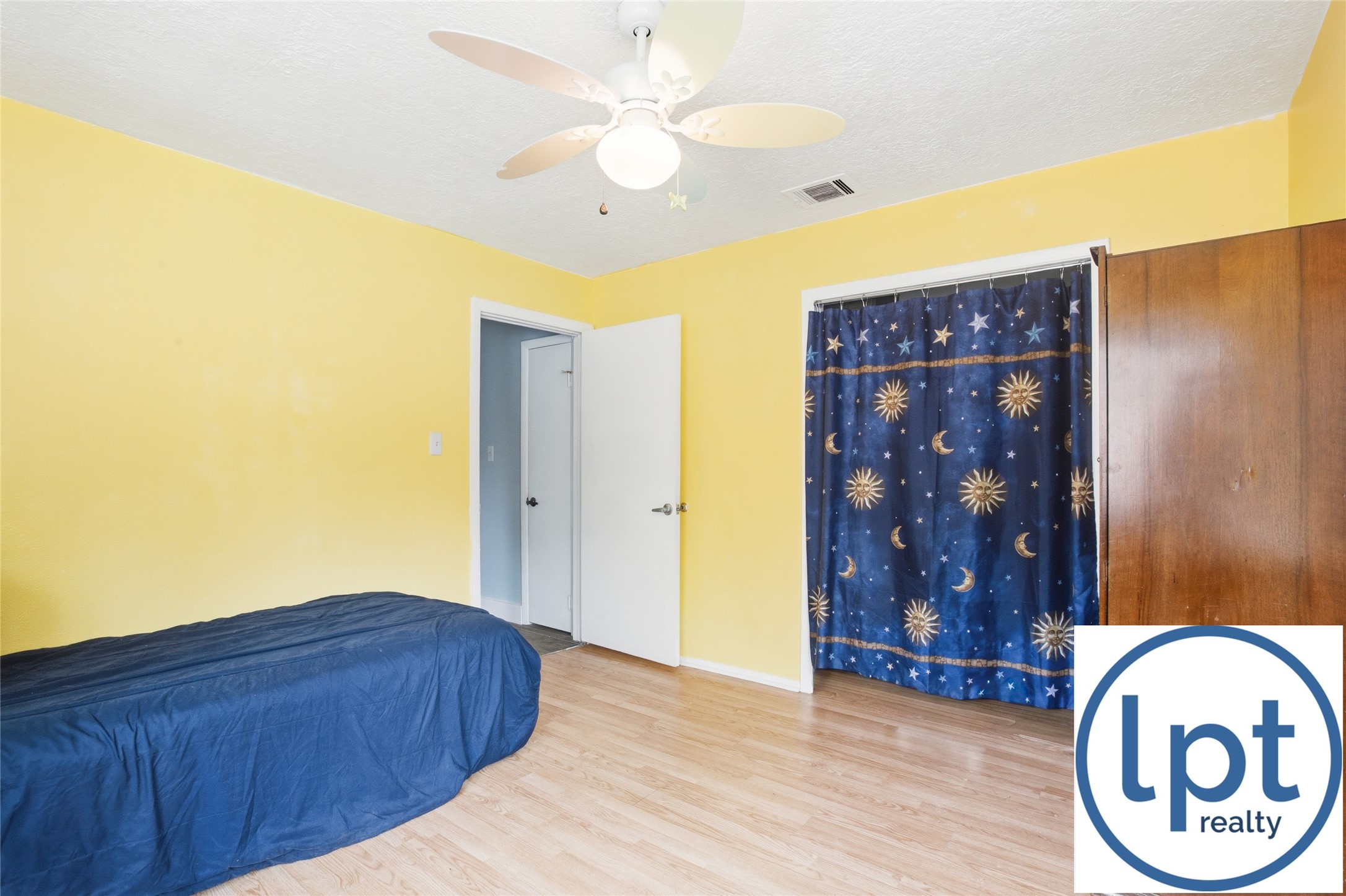 29011 Binefield Street Spring, TX 77386 - Photo 27 of 40 a view of a hallway with wooden floor and a chandelier