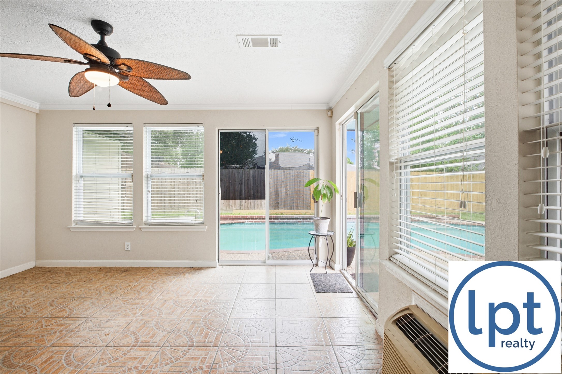 29011 Binefield Street Spring, TX 77386 - Photo 34 of 40 a view of a livingroom with a ceiling fan and window