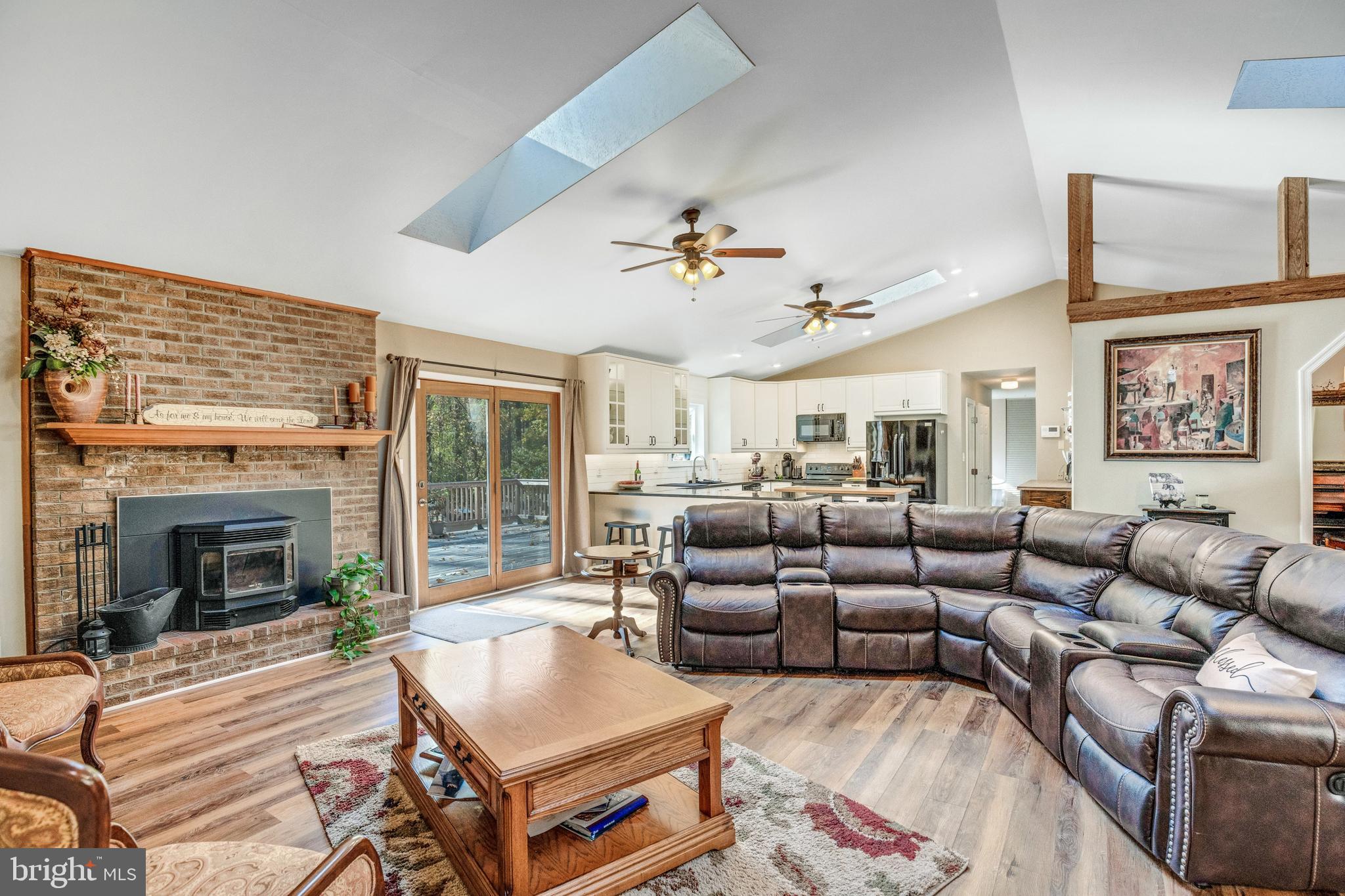 920 Carson Road Huntingtown, MD 20639 - Photo 3 of 32 a living room with furniture fireplace and a large window