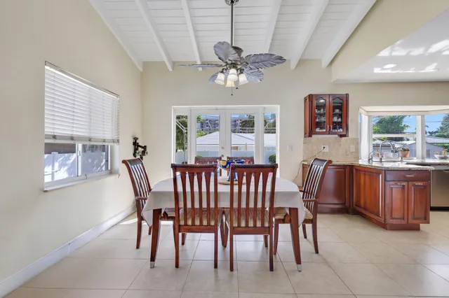 a kitchen with a refrigerator sink and cabinets