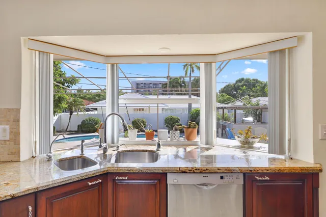 a bedroom with a bed chair and a window