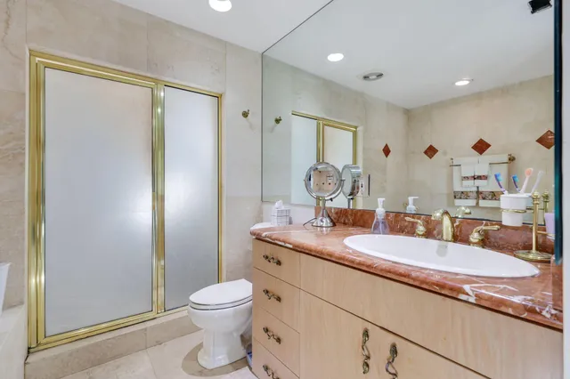 a view of a house with swimming pool and sitting area