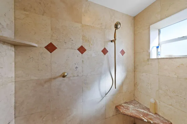 a view of a house with swimming pool and sitting area