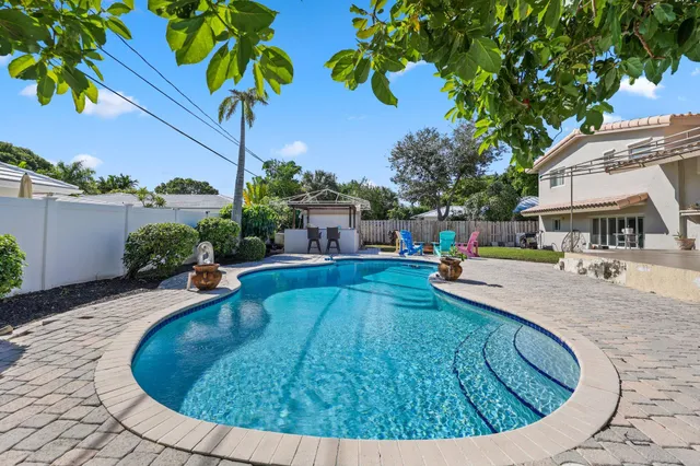 an aerial view of residential houses with city view