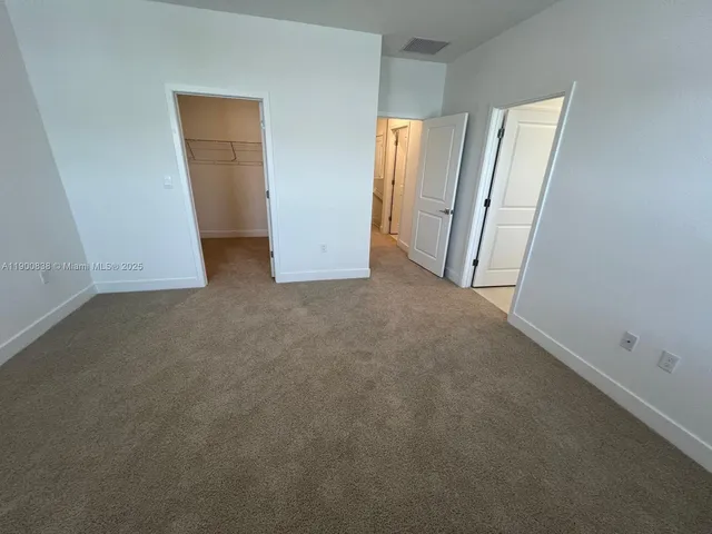 a bathroom with a double vanity sink and mirror