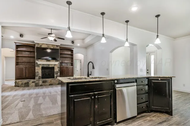 a kitchen with a sink and stove