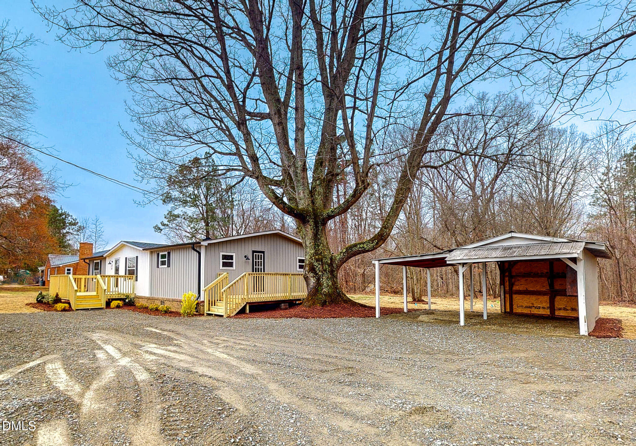 67 Halifax Road Roxboro, NC 27574 - Photo 47 of 48 a front view of a house with a yard and car parked