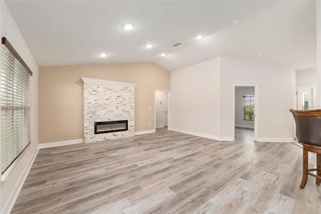 a view of kitchen with furniture and wooden floor