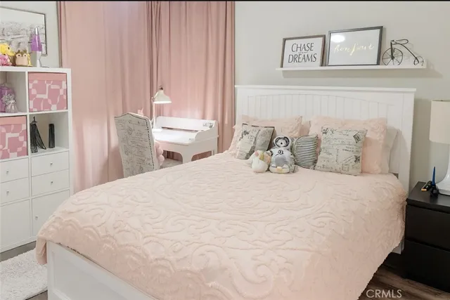 a bedroom with a bed and a cabinets