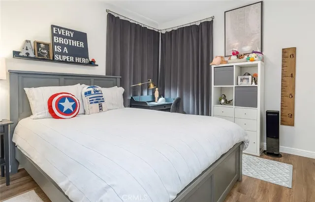 a bedroom with bed and a closet