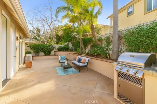 a view of a patio with a table and chairs