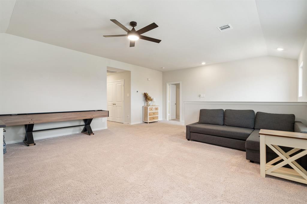 2232 Sun Star Drive Haslet, TX 76052 - Photo 16 of 40 a living room with furniture and a ceiling fan