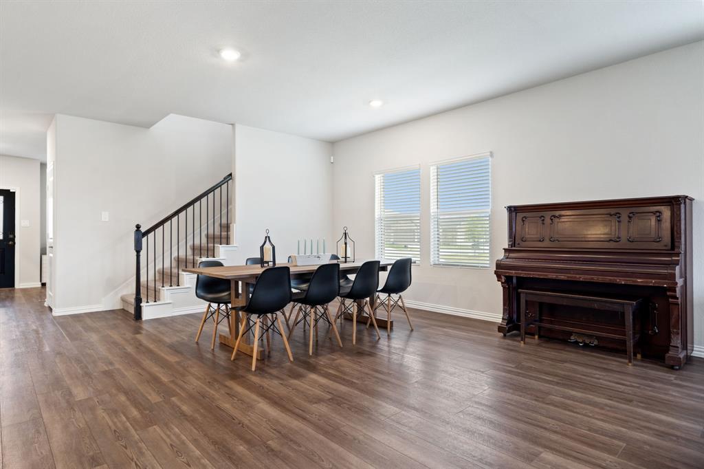 2232 Sun Star Drive Haslet, TX 76052 - Photo 19 of 40 a view of a dining room with furniture and wooden floor