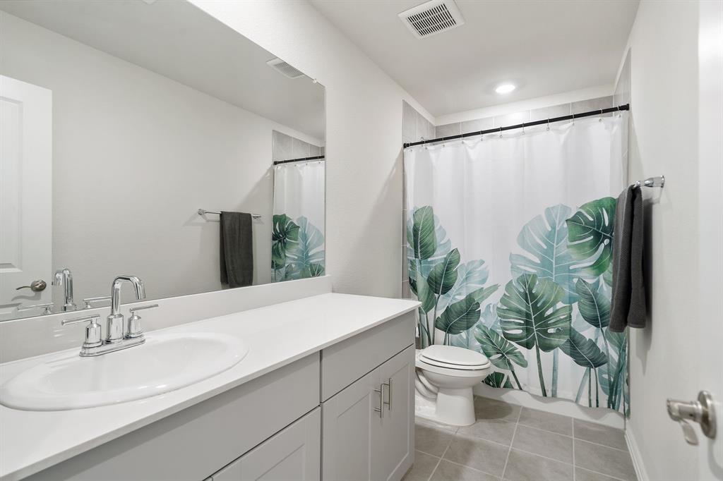 2232 Sun Star Drive Haslet, TX 76052 - Photo 29 of 40 a bathroom with a sink a toilet and a mirror