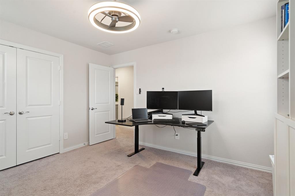 2232 Sun Star Drive Haslet, TX 76052 - Photo 32 of 40 a view of a workspace with a flat screen tv