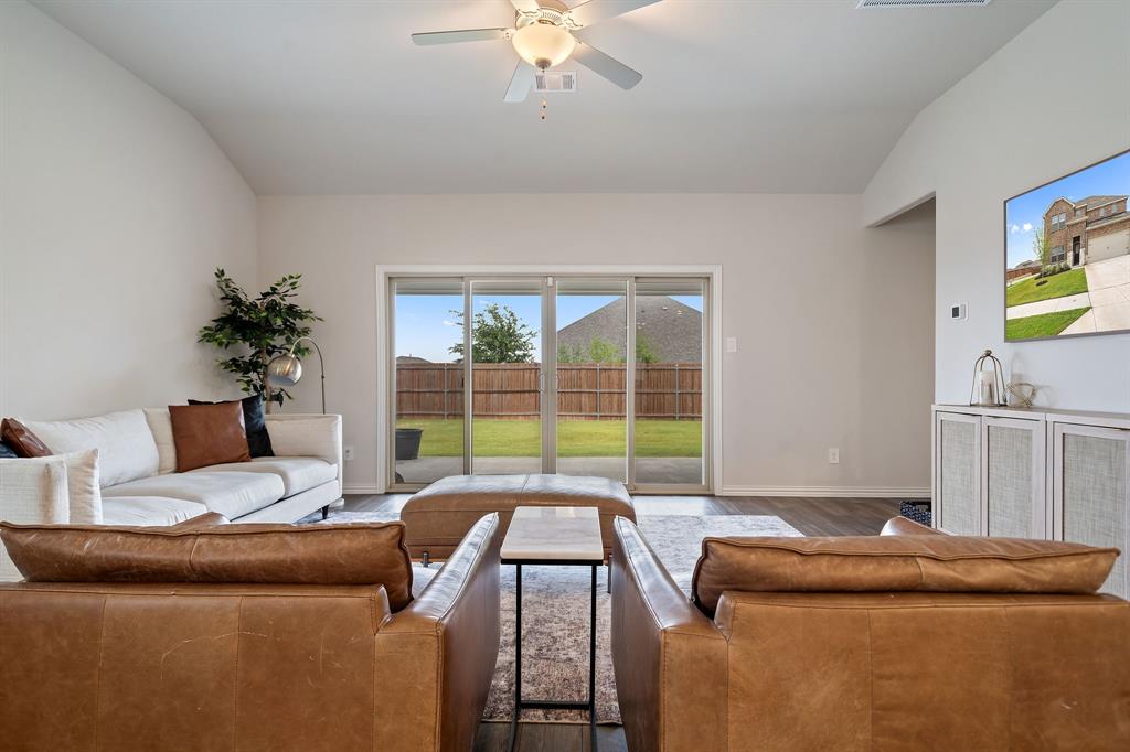 2232 Sun Star Drive Haslet, TX 76052 - Photo 5 of 40 a living room with furniture and a floor to ceiling window