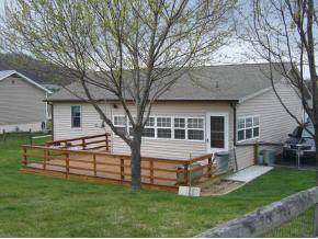 212 Buckboard Road Waynesboro, VA 22980 - Photo 5 of 12 a front view of house with a garden and chairs