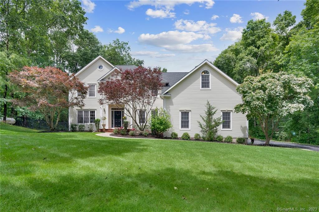12 Stoney Brook Road Wallingford, CT 06492 - Photo 1 of 1 a front view of house with yard and green space