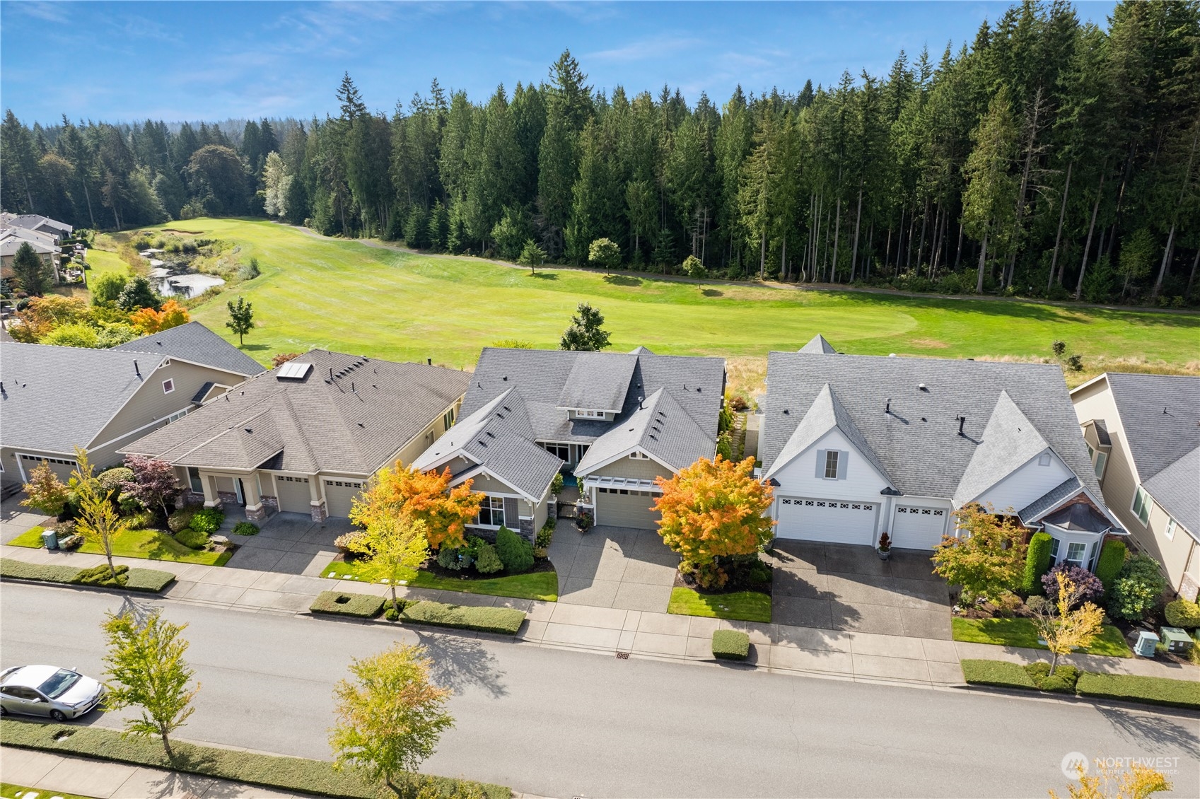 an aerial view of a house with a swimming pool yard and outdoor seating